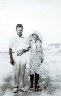 Errol and Madge Gibbins taking a stroll on Alexandra Headland Beach, ca 1930