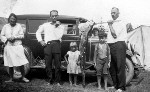 Family group with their fishing catch at Cotton Tree camping grounds, Maroochydore, ca 1940